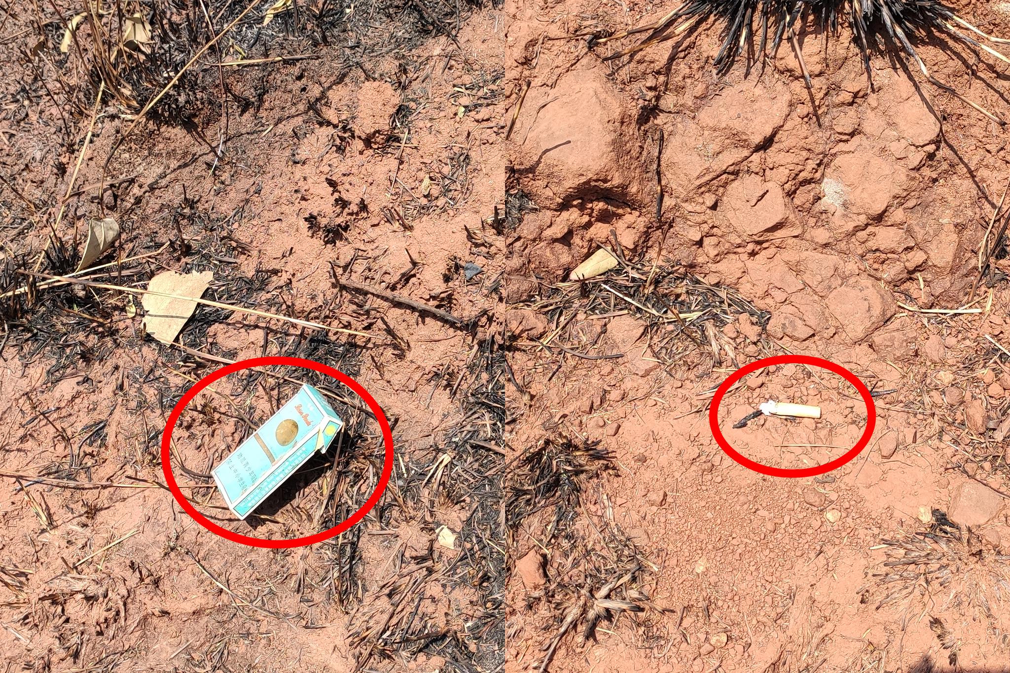  4月9日中午，记者在已烧过的马鞍山上发现了烟盒和烟头。